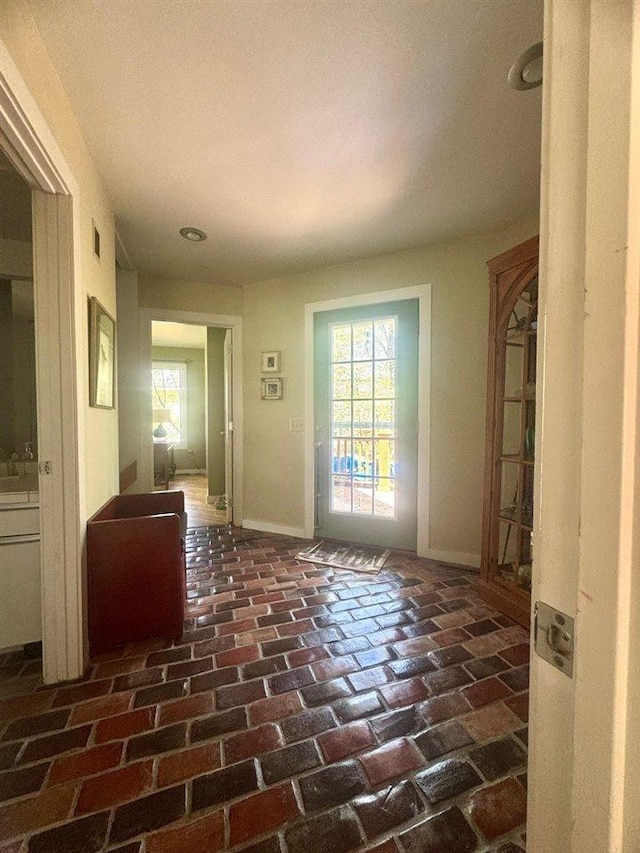 3237 Greenbriar, Harbor Springs, MI 49740 - entrance foyer with brick flooring and baseboards