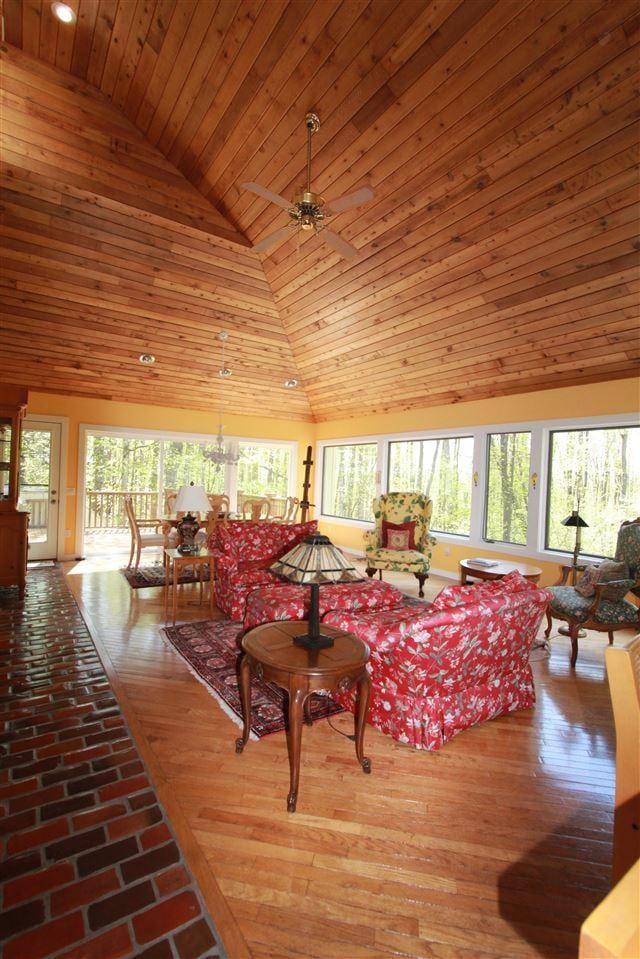 3237 Greenbriar, Harbor Springs, MI 49740 - living area with wood ceiling, ceiling fan, and high vaulted ceiling