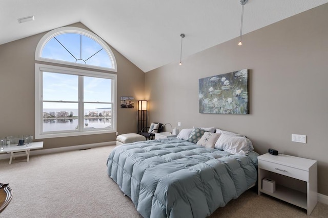 4104 Harborview Rdg Unit 28, Bay Harbor, MI 49770 - carpeted bedroom featuring a water view and high vaulted ceiling