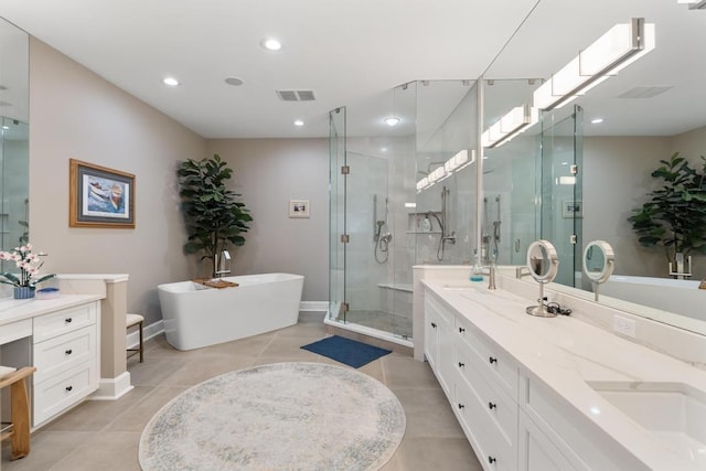 4104 Harborview Rdg Unit 28, Bay Harbor, MI 49770 - bathroom featuring a stall shower, double vanity, a freestanding bath, tile patterned flooring, and baseboards