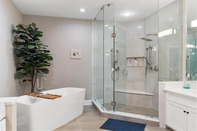4104 Harborview Rdg Unit 28, Bay Harbor, MI 49770 - full bathroom featuring a shower stall, tile patterned flooring, vanity, a freestanding tub, and recessed lighting