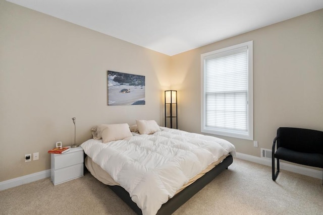 4104 Harborview Rdg Unit 28, Bay Harbor, MI 49770 - bedroom with light carpet and baseboards
