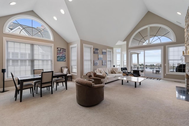 4104 Harborview Rdg Unit 28, Bay Harbor, MI 49770 - living room featuring carpet flooring, high vaulted ceiling, and recessed lighting