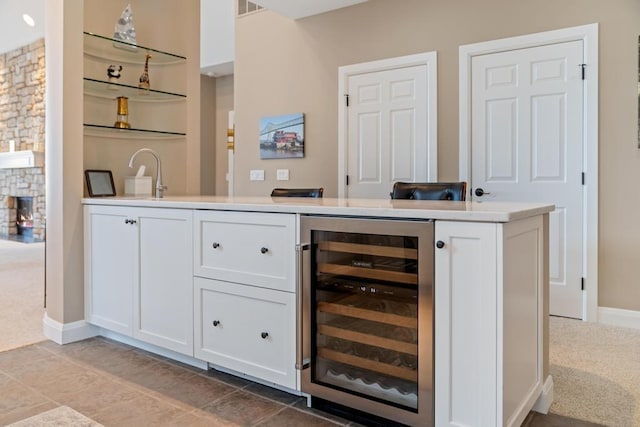 4104 Harborview Rdg Unit 28, Bay Harbor, MI 49770 - indoor bar with beverage cooler, light carpet, and baseboards