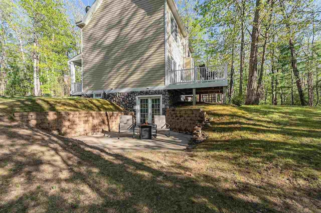 1766 Chippewa Bch, Indian River, MI 49749 - back of house with a patio, a wooden deck, a yard, and french doors