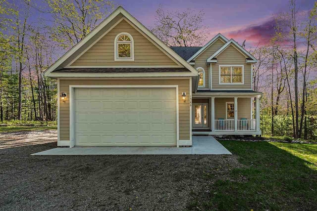 1766 Chippewa Bch, Indian River, MI 49749 - view of front of house featuring covered porch, dirt driveway, and roof with shingles