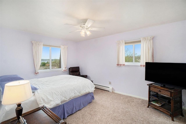 806 Arlington Unit 11, Petoskey, MI 49770 - bedroom with a baseboard radiator, carpet flooring, baseboards, and a ceiling fan