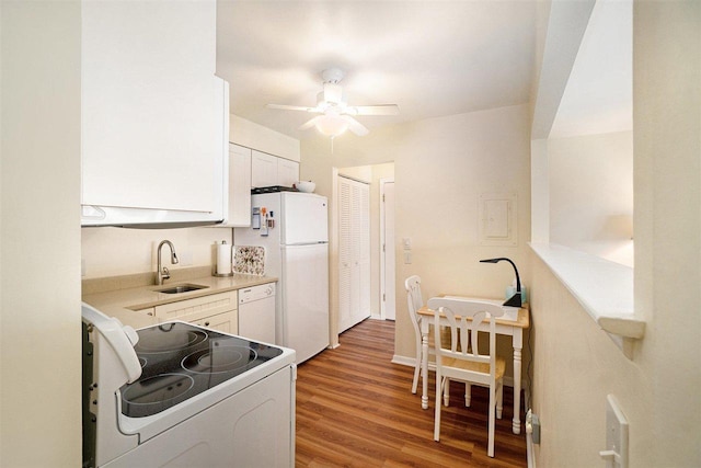 806 Arlington Unit 11, Petoskey, MI 49770 - kitchen with white appliances, a sink, ceiling fan, and white cabinets