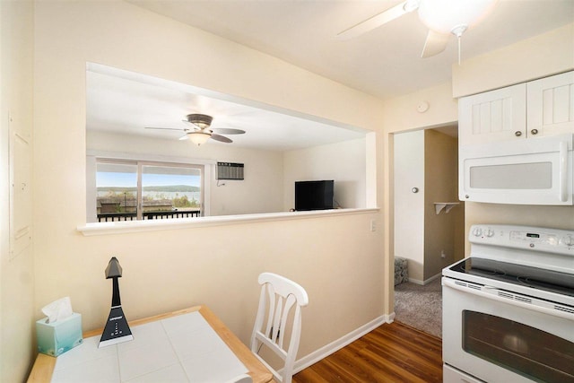 806 Arlington Unit 11, Petoskey, MI 49770 - kitchen featuring white appliances, ceiling fan, wood finished floors, baseboards, and white cabinets