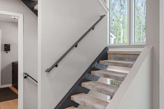 2018 Greenbriar Ter, Harbor Springs, MI 49740 - stairway featuring wood finished floors and baseboards