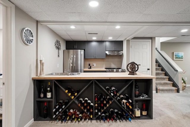 2018 Greenbriar Ter, Harbor Springs, MI 49740 - wine cellar with carpet flooring, baseboards, a sink, a drop ceiling, and recessed lighting