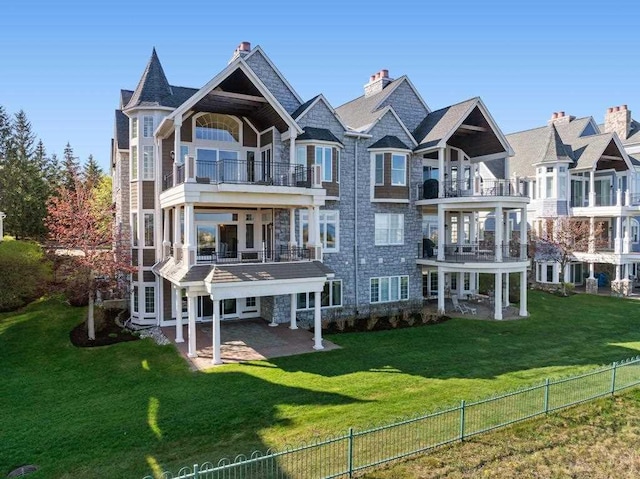 4064 Harborview Rdg Unit 17, Bay Harbor, MI 49770 - rear view of property featuring a patio area and a balcony