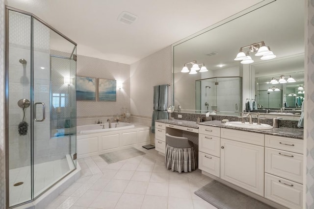 4064 Harborview Rdg Unit 17, Bay Harbor, MI 49770 - bathroom featuring tile patterned floors, a stall shower, vanity, and a garden tub