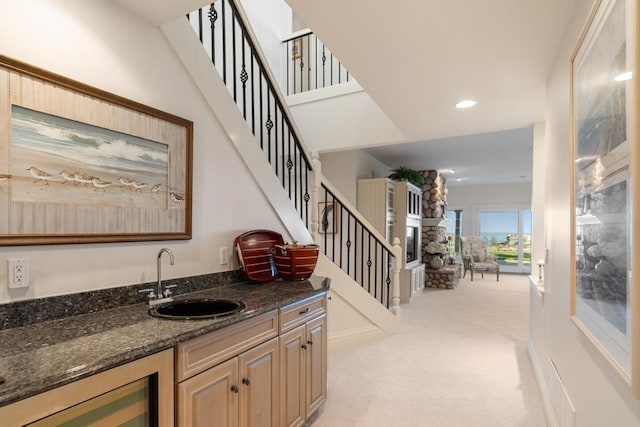 4064 Harborview Rdg Unit 17, Bay Harbor, MI 49770 - indoor wet bar featuring light carpet, wine cooler, stairway, and recessed lighting