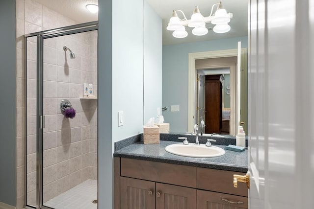 4064 Harborview Rdg Unit 17, Bay Harbor, MI 49770 - full bath featuring a stall shower, connected bathroom, vanity, and a chandelier