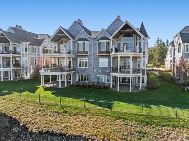 4064 Harborview Rdg Unit 17, Bay Harbor, MI 49770 - rear view of property featuring a balcony and a patio