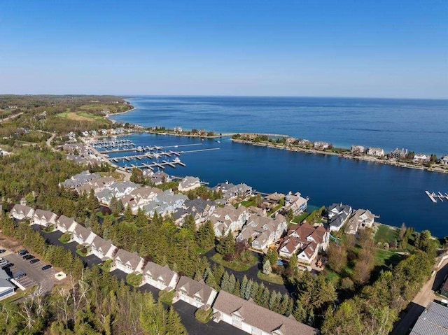 4064 Harborview Rdg Unit 17, Bay Harbor, MI 49770 - aerial view of property and surrounding area with a nearby body of water and nearby suburban area