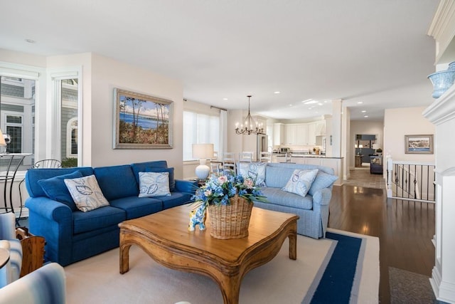 4064 Harborview Rdg Unit 17, Bay Harbor, MI 49770 - living room featuring a chandelier, wood finished floors, and recessed lighting