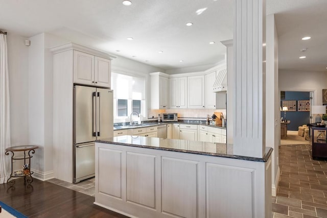 4064 Harborview Rdg Unit 17, Bay Harbor, MI 49770 - kitchen with high quality fridge, a sink, baseboards, recessed lighting, and white cabinets