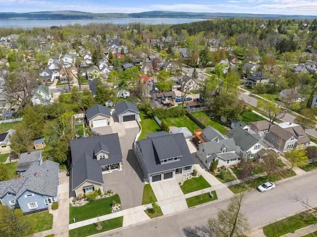 917 Grove St, Petoskey, MI 49770 - aerial view of property and surrounding area featuring nearby suburban area and a large body of water