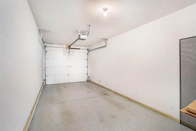 1556 Emerald Ct Unit 89, Petoskey, MI 49770 - garage with baseboards and a garage door opener