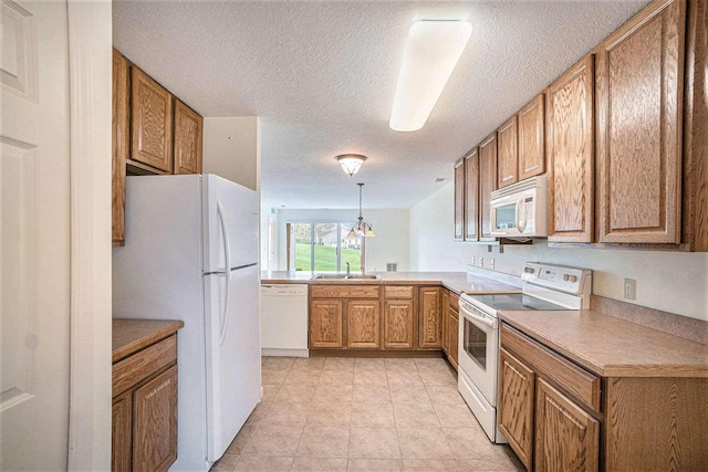 1556 Emerald Ct Unit 89, Petoskey, MI 49770 - kitchen with white appliances, a sink, brown cabinetry, a textured ceiling, and light tile patterned floors