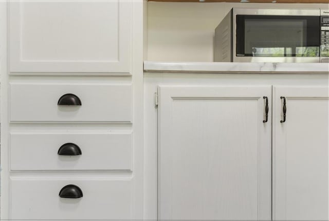 7245-83 Upper Kelsey Dr, Charlevoix, MI 49720 - detailed view of stainless steel microwave