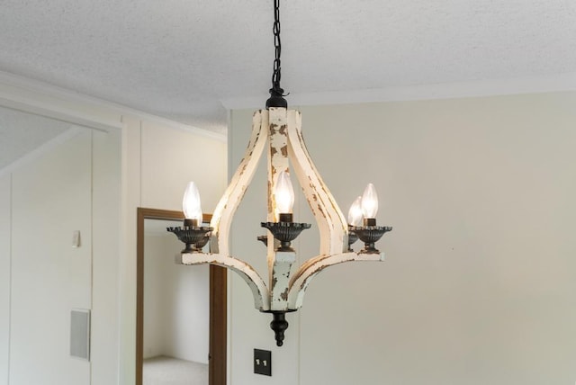 7245-83 Upper Kelsey Dr, Charlevoix, MI 49720 - detailed view of crown molding and a textured ceiling