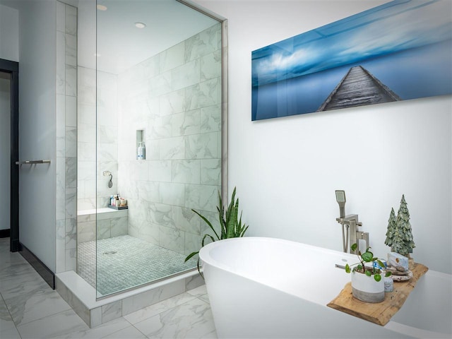 422 E Mitchell Unit 1, Petoskey, MI 49770 - full bath featuring marble look tiles, a shower stall, and a freestanding tub