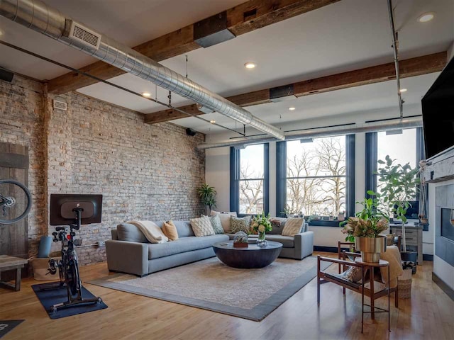 422 E Mitchell Unit 1, Petoskey, MI 49770 - living area featuring beam ceiling and wood finished floors