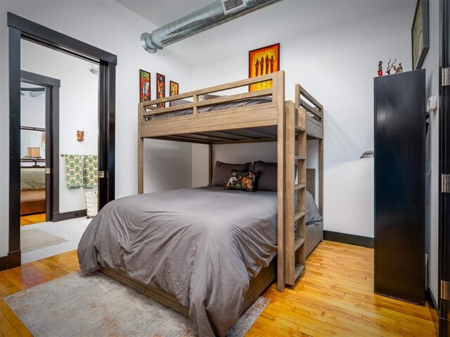 422 E Mitchell Unit 1, Petoskey, MI 49770 - bedroom with wood-type flooring and baseboards