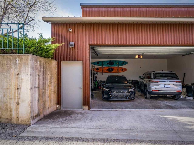 422 E Mitchell Unit 1, Petoskey, MI 49770 - garage with a garage door opener and driveway