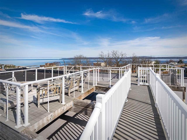 422 E Mitchell Unit 1, Petoskey, MI 49770 - wooden deck featuring a water view