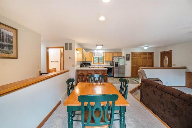 4024 Behling, Boyne City, MI 49712 - dining room with light colored carpet and baseboards