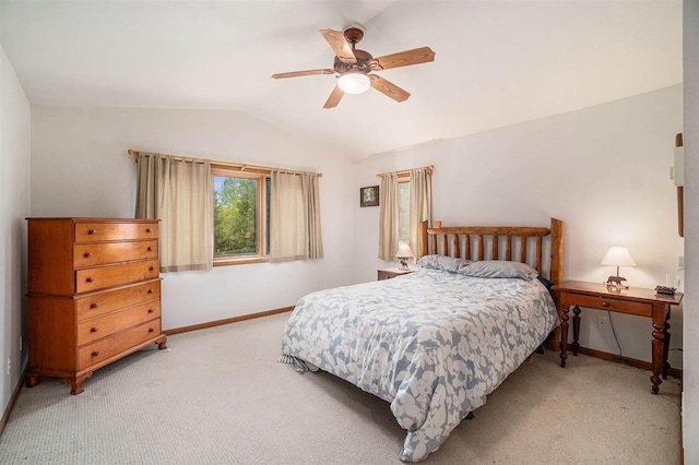 4024 Behling, Boyne City, MI 49712 - bedroom with lofted ceiling, baseboards, light carpet, and a ceiling fan