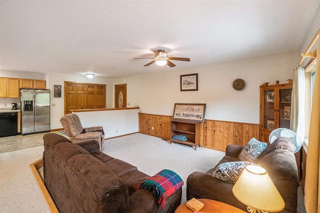 4024 Behling, Boyne City, MI 49712 - living area with wainscoting, a ceiling fan, light carpet, and wooden walls