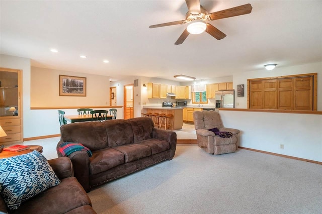 4024 Behling, Boyne City, MI 49712 - living area featuring light carpet, baseboards, a ceiling fan, and recessed lighting