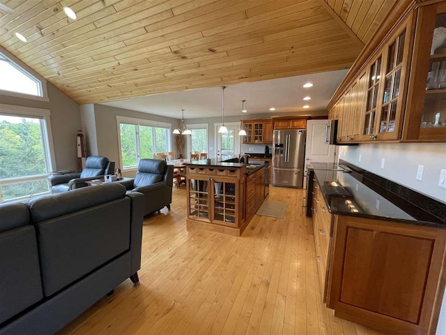 9030 Sugar Tree Ln, Charlevoix, MI 49720 - living room with wooden ceiling, light wood finished floors, lofted ceiling, and recessed lighting