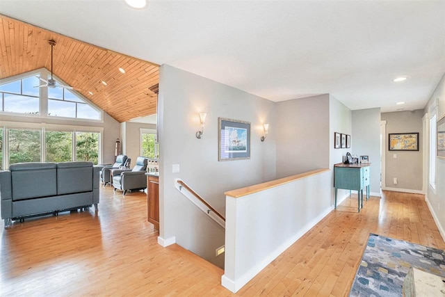 9030 Sugar Tree Ln, Charlevoix, MI 49720 - corridor with an upstairs landing, light wood-type flooring, baseboards, recessed lighting, and vaulted ceiling