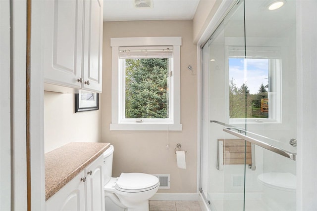 9030 Sugar Tree Ln, Charlevoix, MI 49720 - bathroom featuring toilet, a shower stall, baseboards, vanity, and tile patterned floors