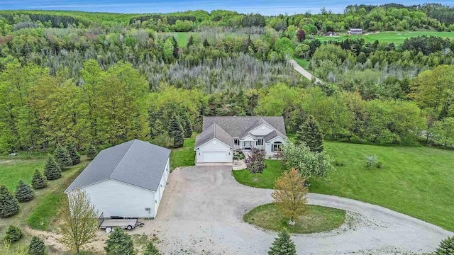 9030 Sugar Tree Ln, Charlevoix, MI 49720 - view of subject property with a forest