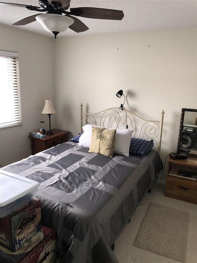 915 Robinson St Unit 2, Boyne City, MI 49712 - carpeted bedroom with a ceiling fan