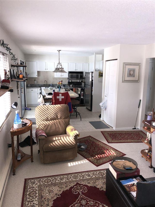 915 Robinson St Unit 2, Boyne City, MI 49712 - living room featuring baseboards