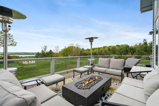 8530 Dustin Ln, East Jordan, MI 49727 - view of patio / terrace with an outdoor living space with a fire pit