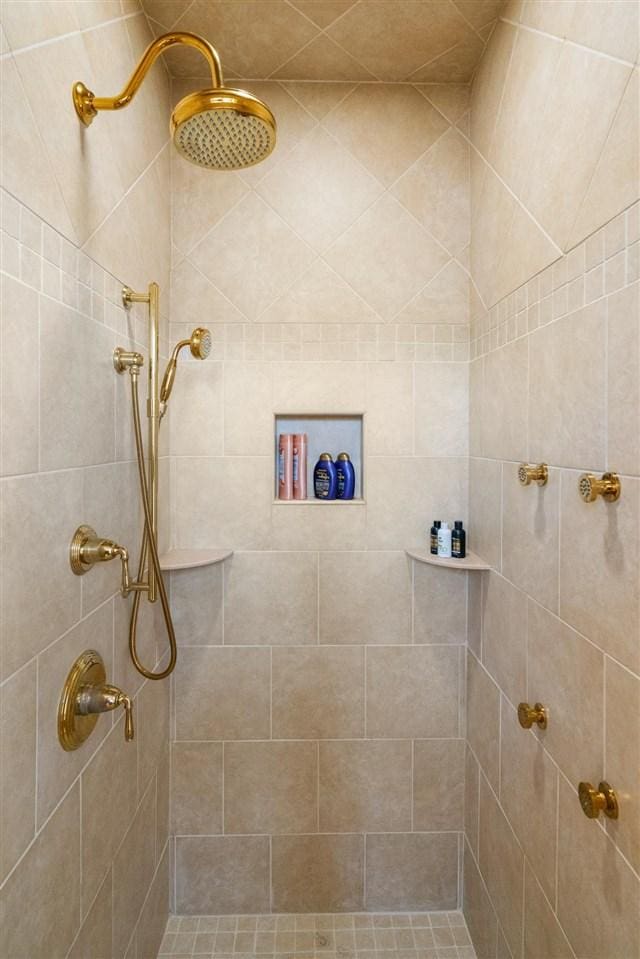 8530 Dustin Ln, East Jordan, MI 49727 - full bath featuring a tile shower