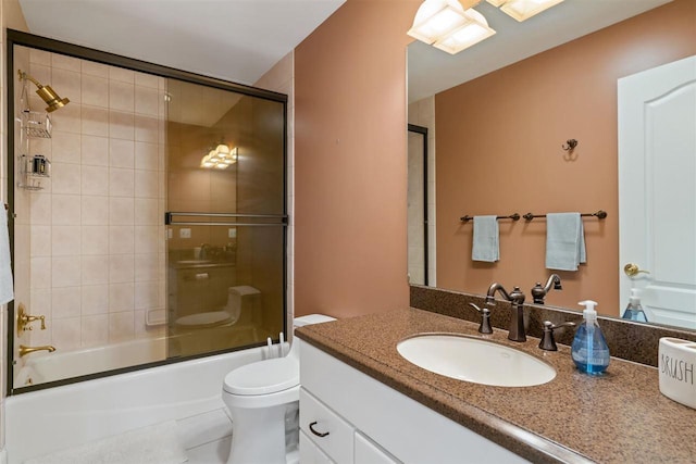 8530 Dustin Ln, East Jordan, MI 49727 - bathroom with vanity, toilet, and shower / bath combination with glass door