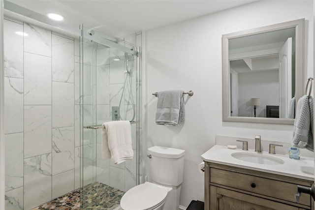 8530 Dustin Ln, East Jordan, MI 49727 - bathroom featuring vanity, a marble finish shower, toilet, and recessed lighting
