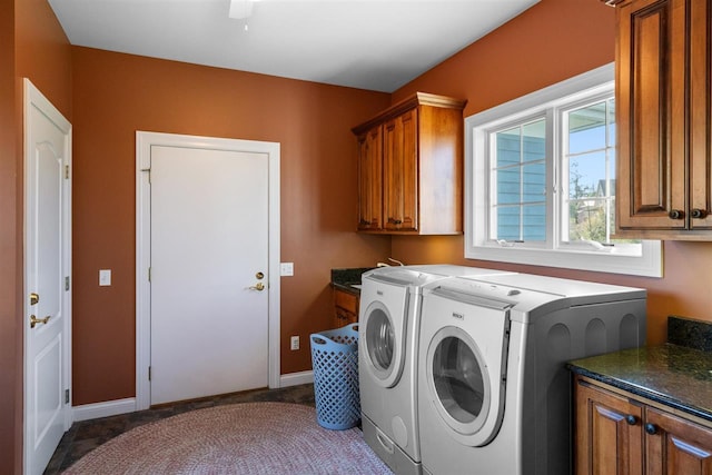 8530 Dustin Ln, East Jordan, MI 49727 - washroom featuring separate washer and dryer, cabinet space, and baseboards