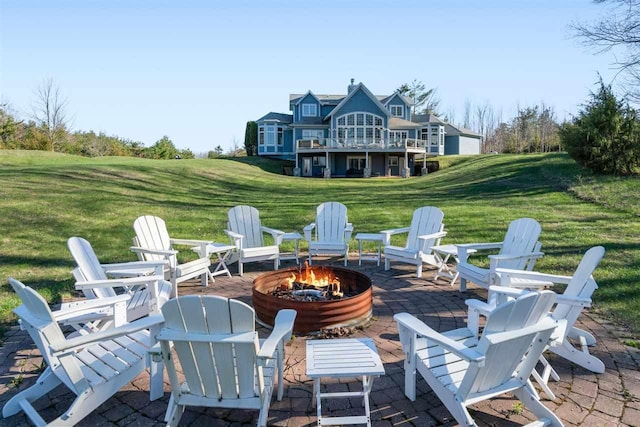 8530 Dustin Ln, East Jordan, MI 49727 - view of patio / terrace with an outdoor fire pit