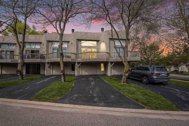 302 Quaintance Ave, Petoskey, MI 49770 - multi unit property with a garage, driveway, and stairway